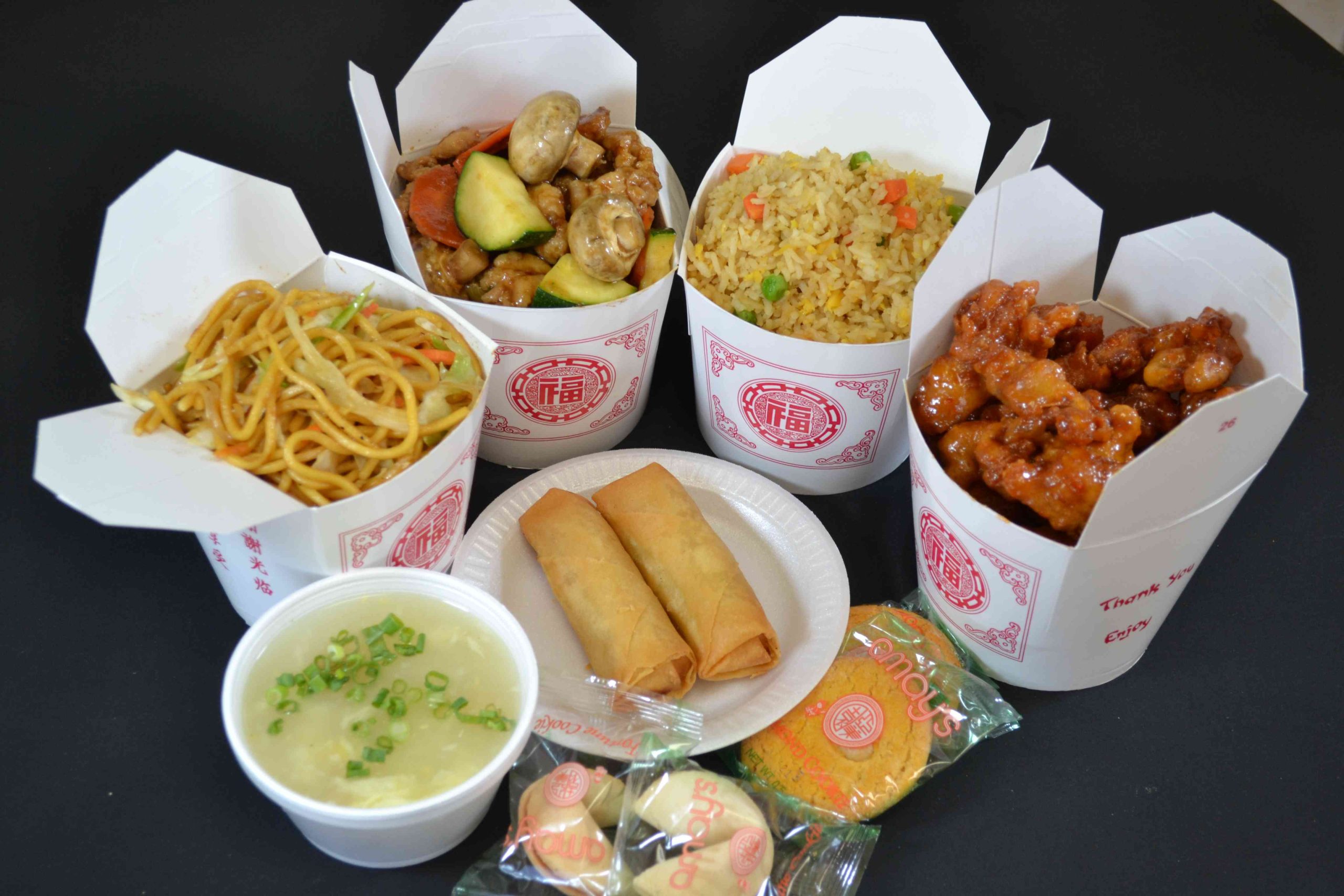 Combo meal with lo mein fried rice stir fry orange chicken spring rolls soup and cookies at Diamond Panda, a Chinese Restaurant in Victorville