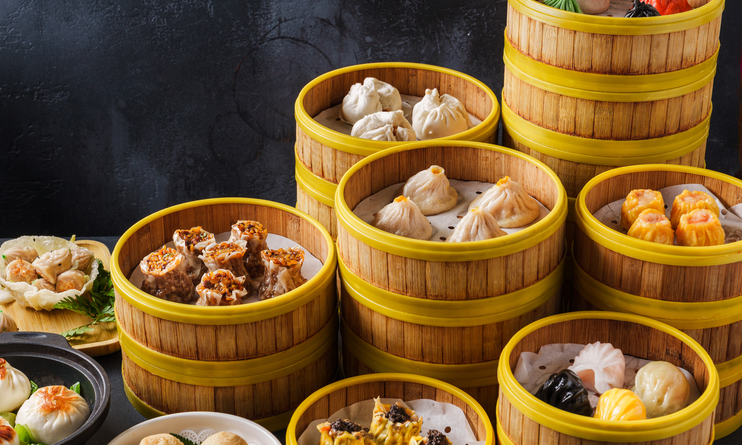 Tower of assorted dim sum with dumplings, siu mai and har gow at Dim Sum Bloom Rockville Centre, a Chinese Restaurant in Rockville Centre
