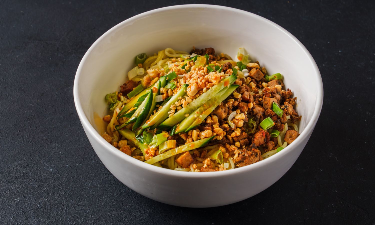 Spicy minced pork noodles with cucumber and peanuts at Dim Sum Bloom Rockville Centre, a Chinese Restaurant in Rockville Centre