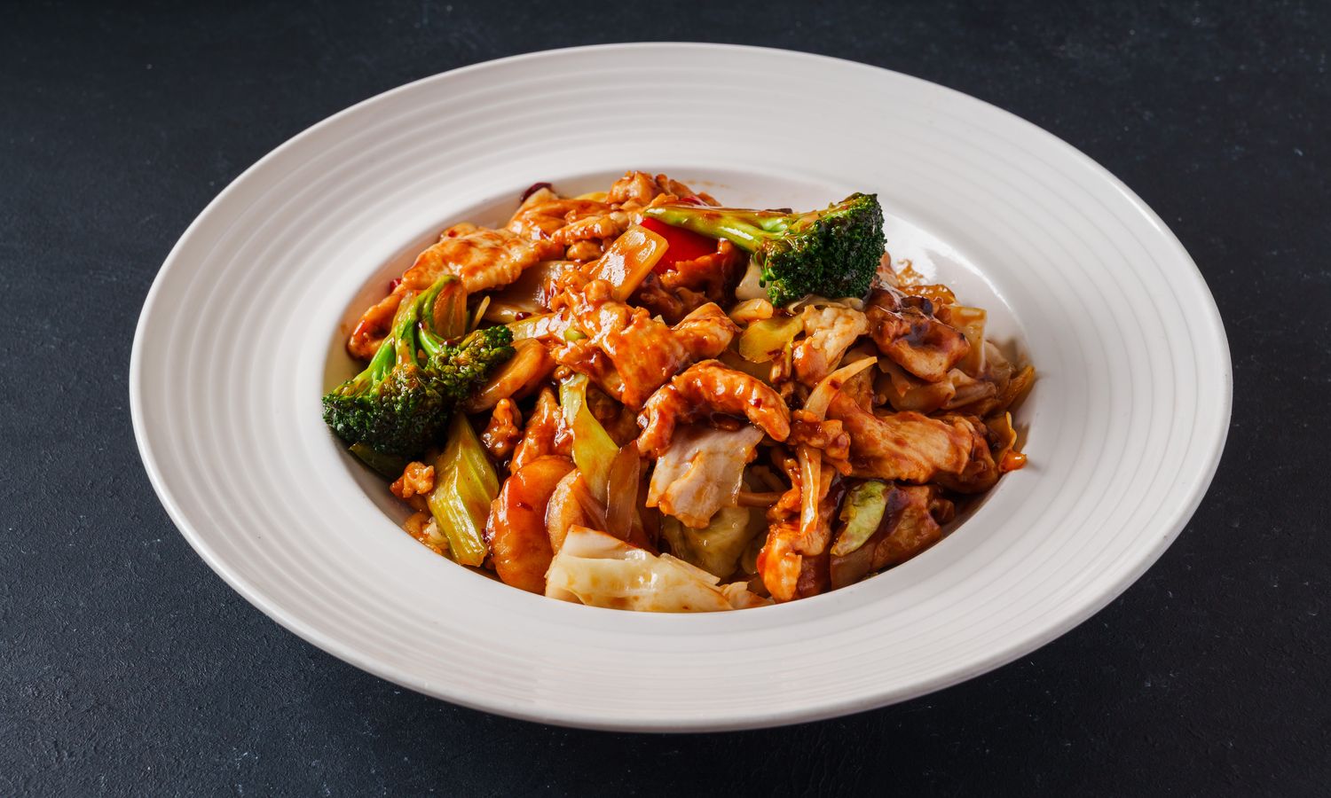 Spicy Hunan-style chicken with broccoli and vegetables at Dim Sum Bloom Rockville Centre, a Chinese Restaurant in Rockville Centre