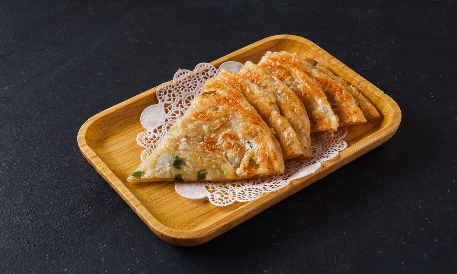 Flaky crispy pancake with fresh scallions at Dim Sum Bloom Rockville Centre, a Chinese Restaurant in Rockville Centre