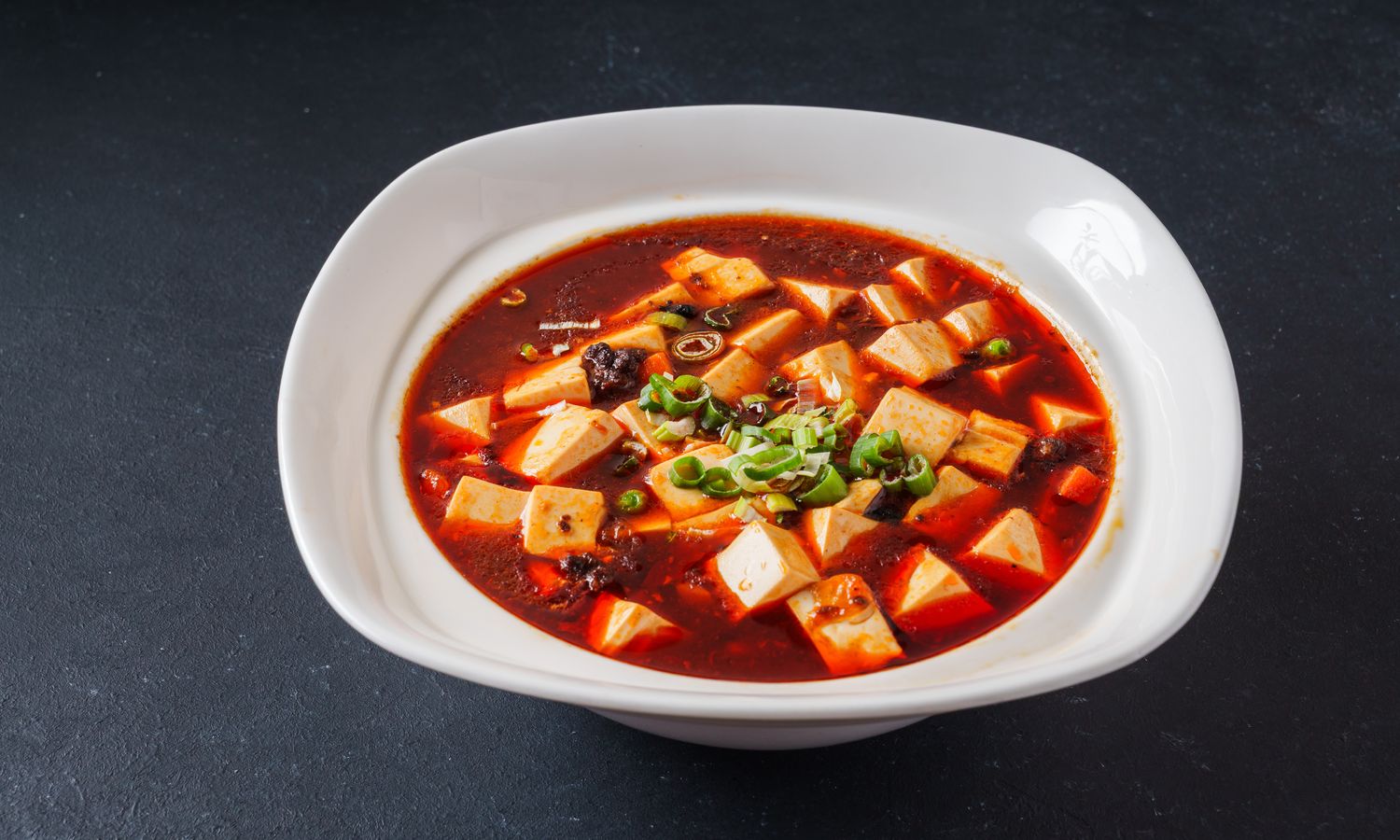 Silky tofu in spicy Sichuan sauce with minced pork at Dim Sum Bloom Rockville Centre, a Chinese Restaurant in Rockville Centre