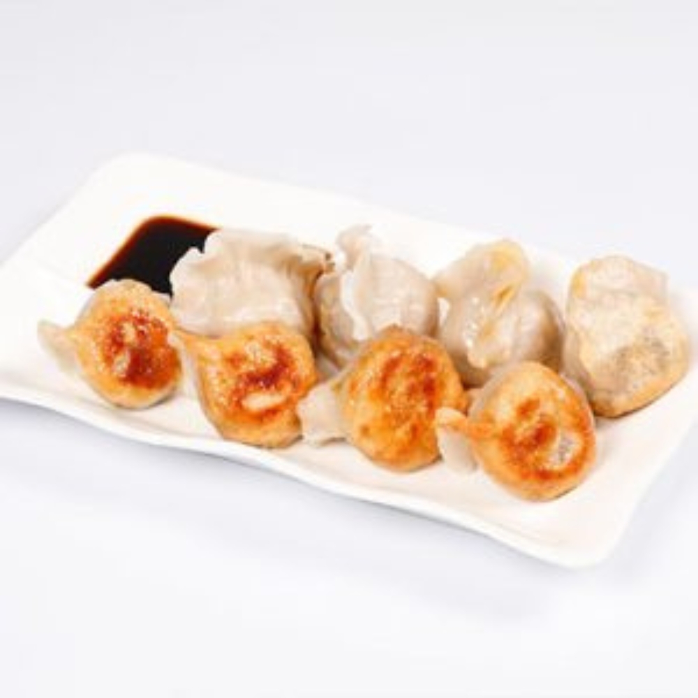 Pan-fried dumplings served with dark soy sauce at Tom's Dim Sum, a Dim Sum Restaurant in PA