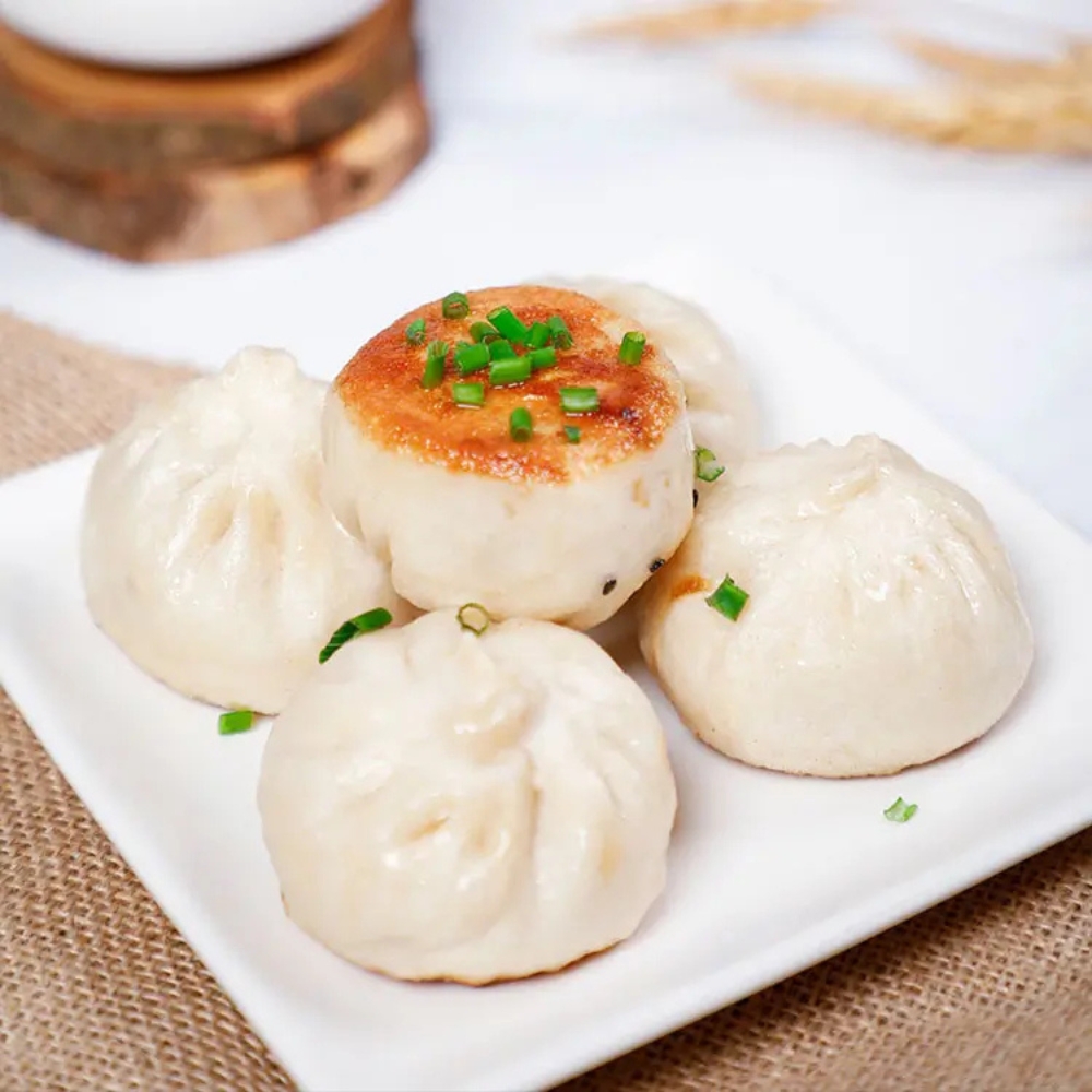 Pan-fried pork buns topped with chopped green onion at Tom's Dim Sum, a Dim Sum Restaurant in PA