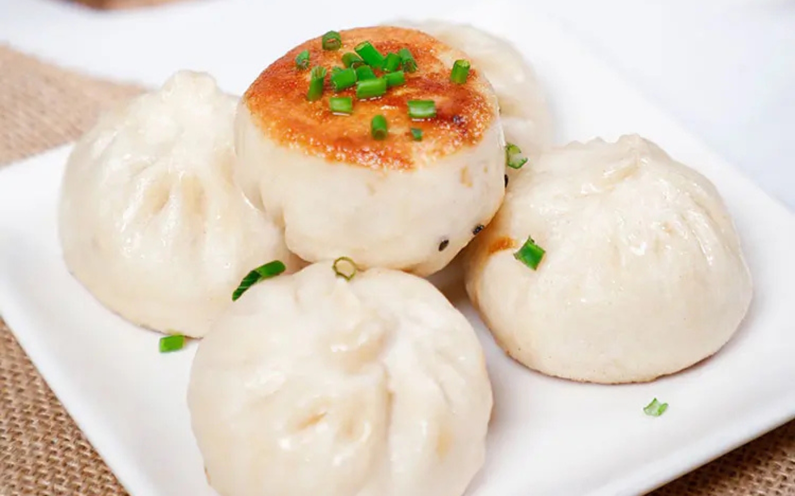 Pan-fried pork buns with crispy bottom and chopped green onion at Tom's Dim Sum, a Dim Sum Restaurant in PA