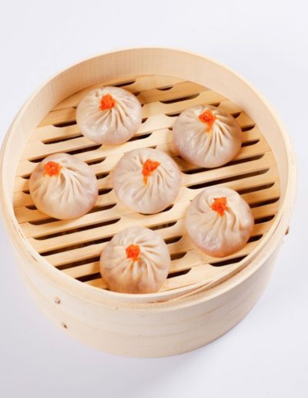 Six fish roe soup dumplings neatly arranged in bamboo steamer at Tom's Dim Sum, a Dim Sum Restaurant in PA