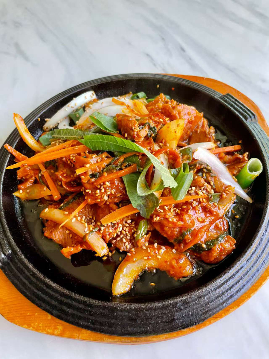 Marinated thinly slice pork in spicy special sauce at Dim Sum & Kimchi，a Asian Fusion Restaurant in Bettendorf