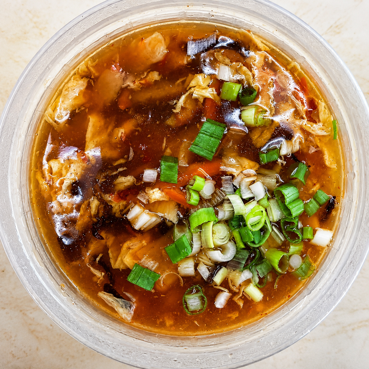 Hot and sour soup with green onions at Dragon Express, a Chinese Restaurant in Augusta