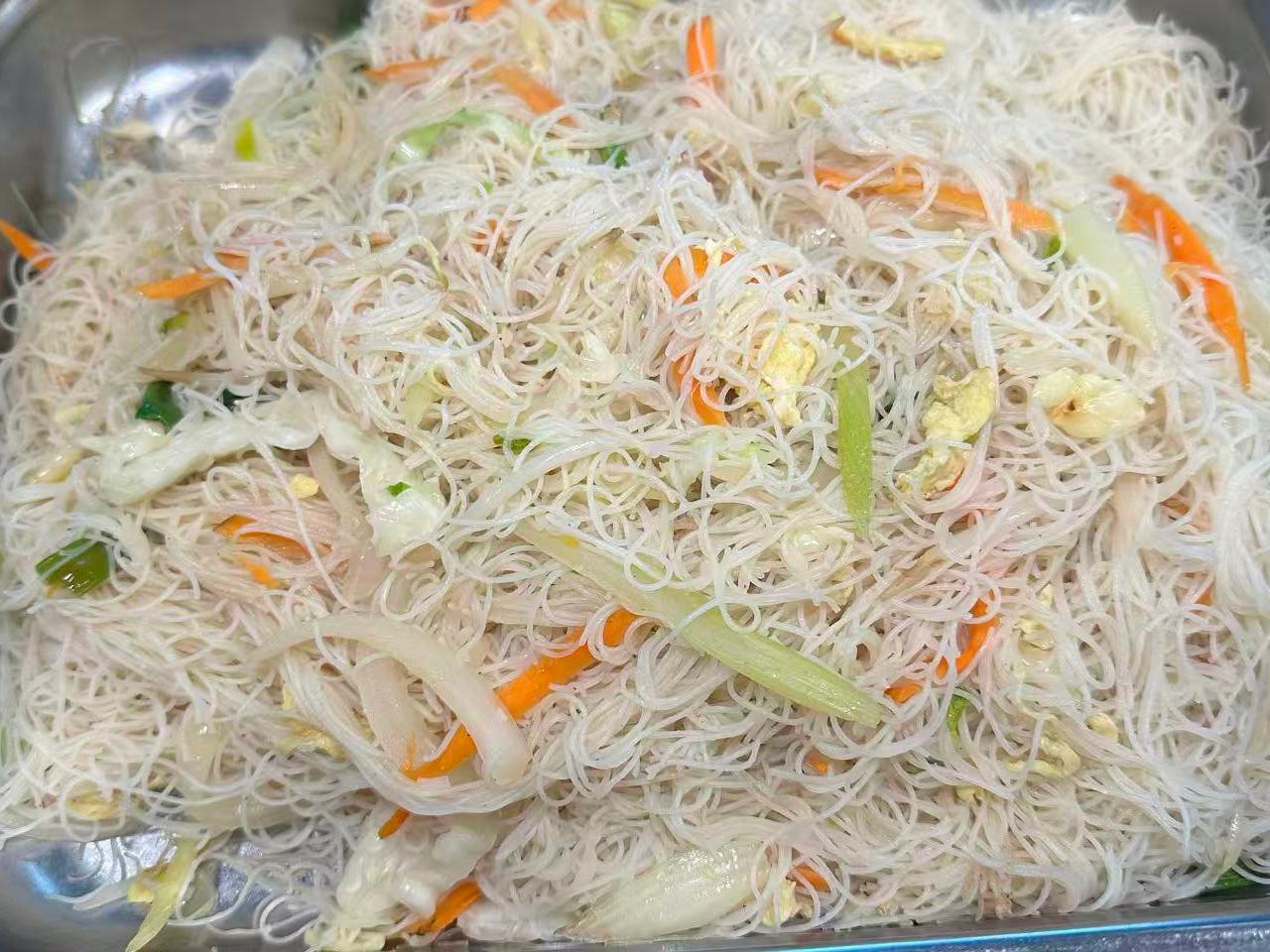 Fried rice noodles mixed with eggs, carrots and cabbage at Dragon Garden, a Chinese Restaurant in Palmdale