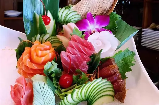 Artistically arranged assorted fresh sashimi platter at Dragon Sushi, a Japanese Restaurant in New York