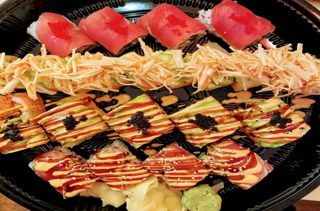 Mixed sushi platter with various colorful sushi rolls at Dragon Sushi, a Japanese Restaurant in New York