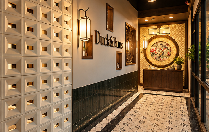 Split view of Duck & Buns restaurant showing dining tables and the entry hallway