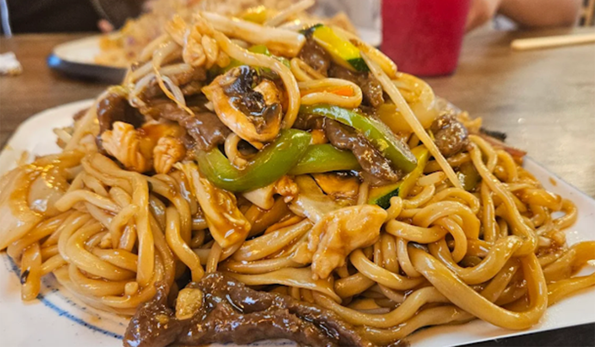 Fried noodles on the plate, with firm noodles, paired with vegetables and meat at Southside Dumpling Haus, a Chinese Restaurant in Corpus Christi