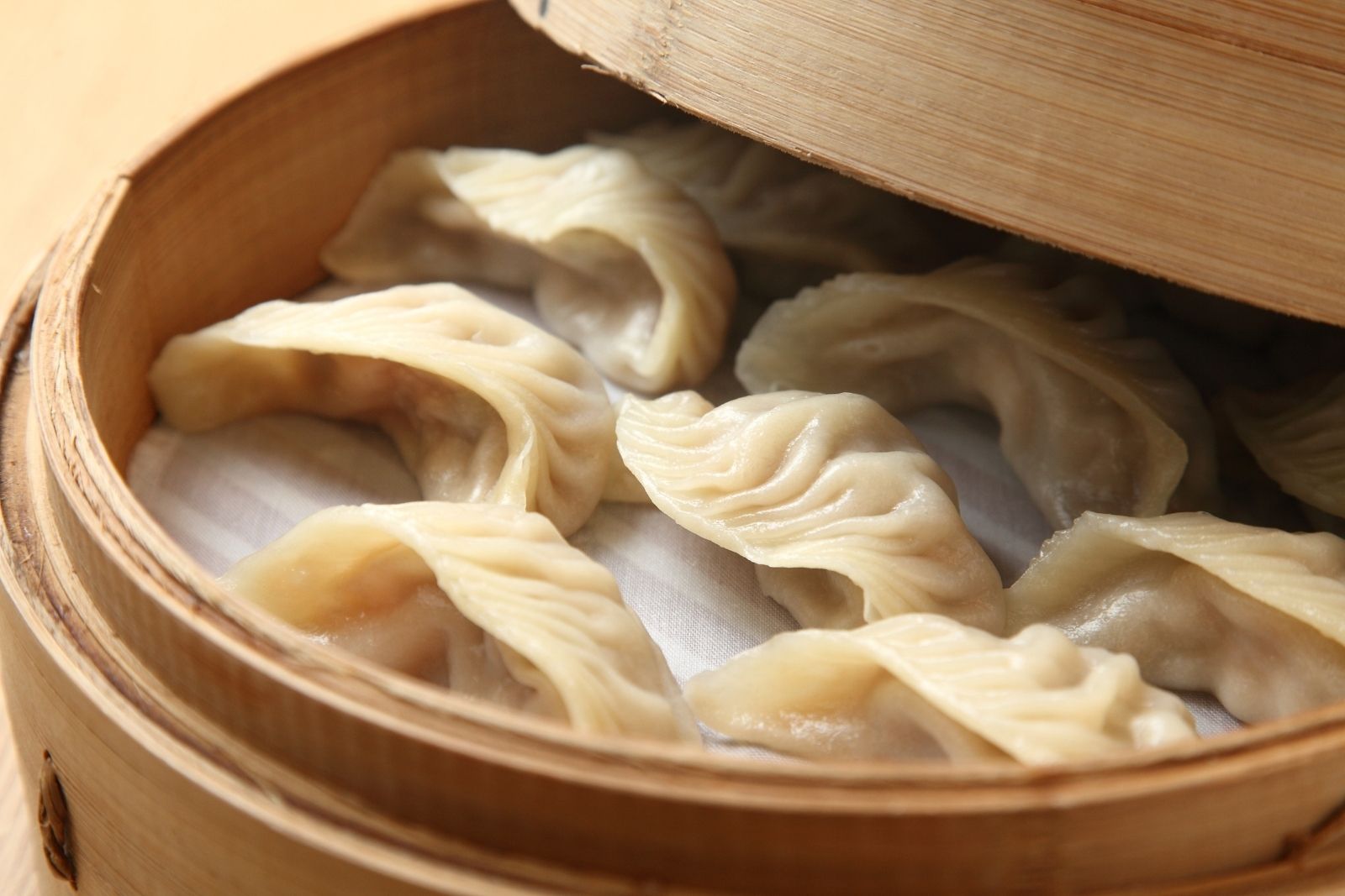 Steamed meat dumplings in bamboo steamer at Dumpling Bay, a Chinese Restaurant in Golden