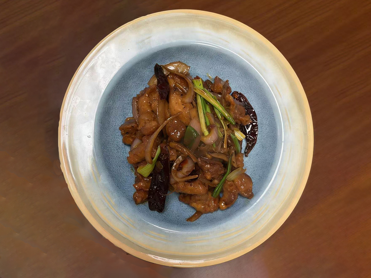 Stir-fried meat with spicy chilies and fragrant scallions at Dumpling House, an Asian Restaurant in Harrisonburg
