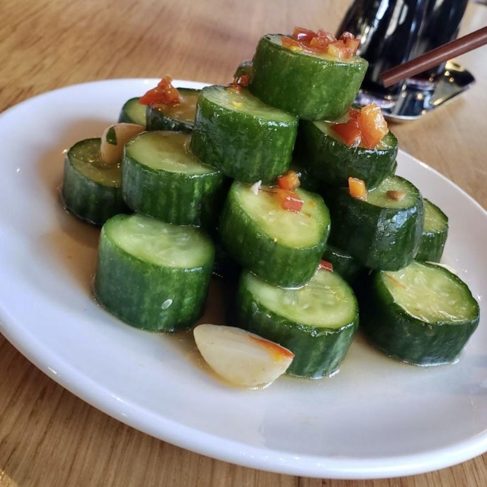 Refreshing cucumber salad with garlic and diced peppers at Dumpling King Asian Cuisine in Sacramento