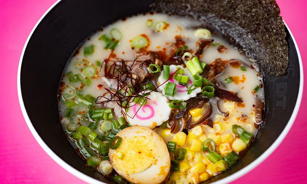 Creamy tonkotsu ramen topped with soft boiled egg, corn, green onions, mushrooms and dried seaweed at Dumplings & Tea, a Asian Restaurant in Chesterfield