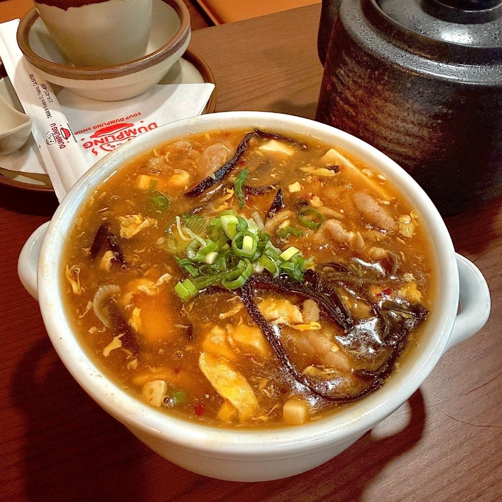 Spicy and sour soup with tofu and veggies at Dumpling U, a Chinese Restaurant in Fresno
