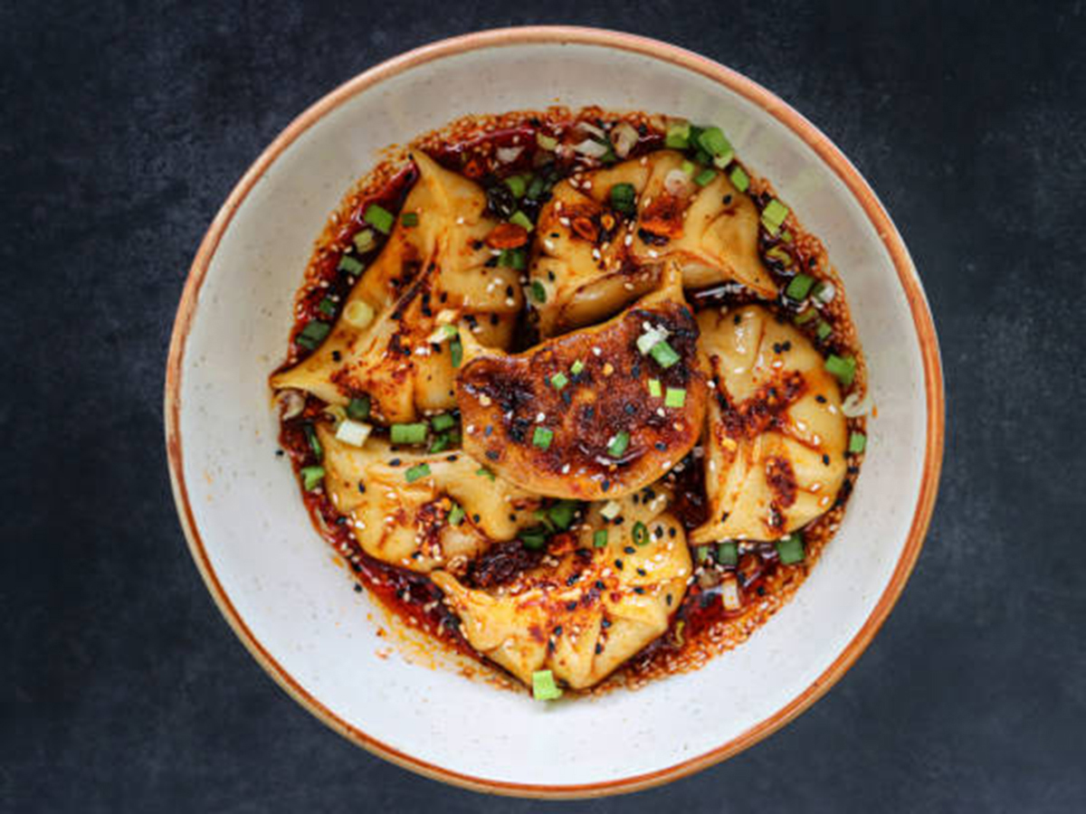 Wontons filled with meat, dressed in spicy red oil at Dumpling Zone, a Chinese restaurant in San Francisco