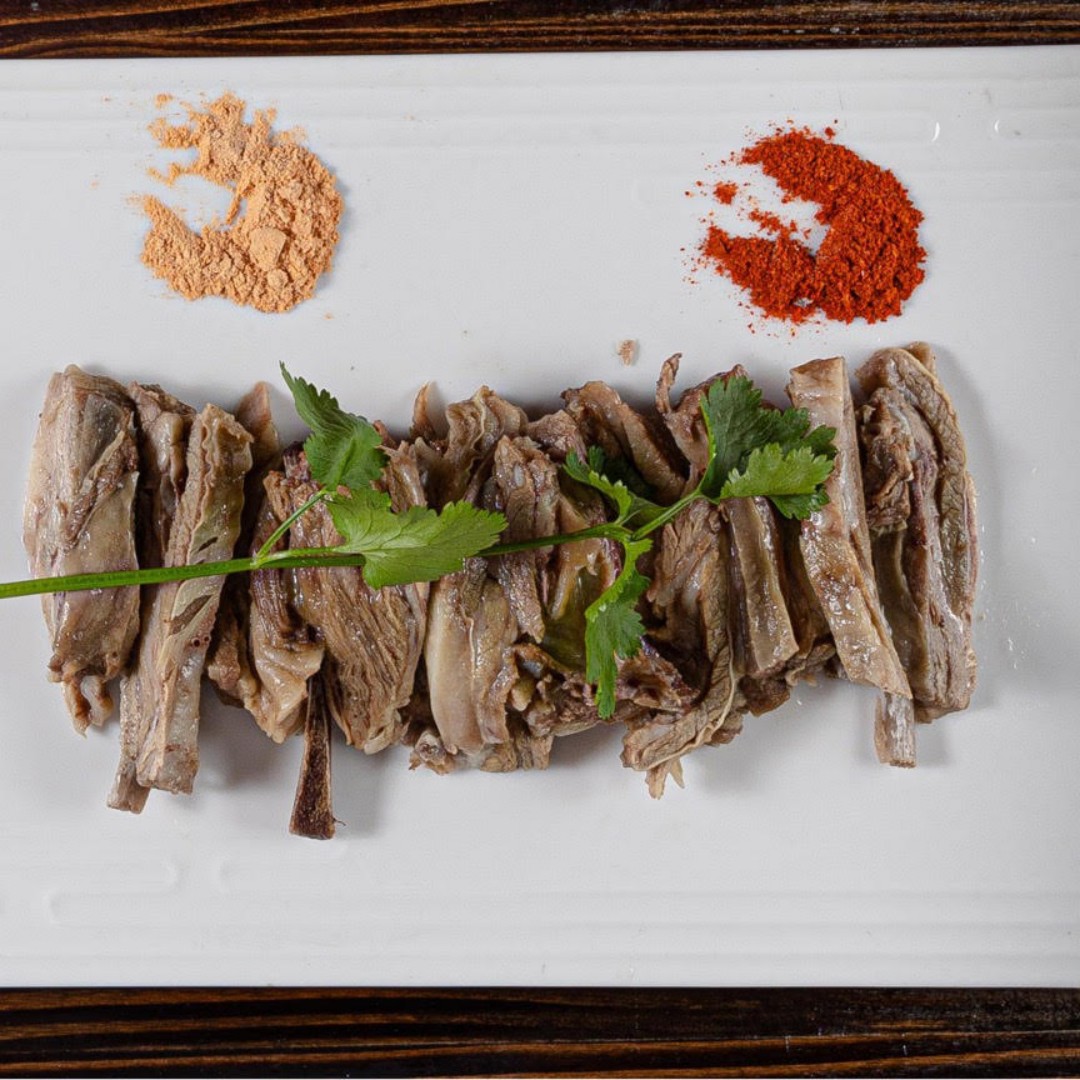 Tender boiled lamb ribs served with two types of dipping spices at Dun Huang, a Chinese Restaurant in Brooklyn