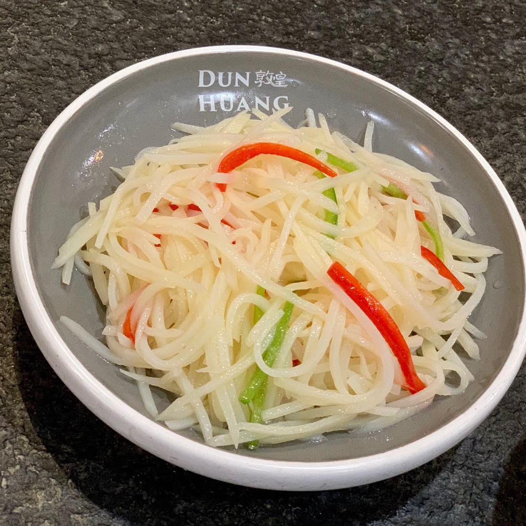 Crisp stir‑fried potato shreds with red and green bell peppers at Dun Huang, a Chinese Restaurant in Brooklyn