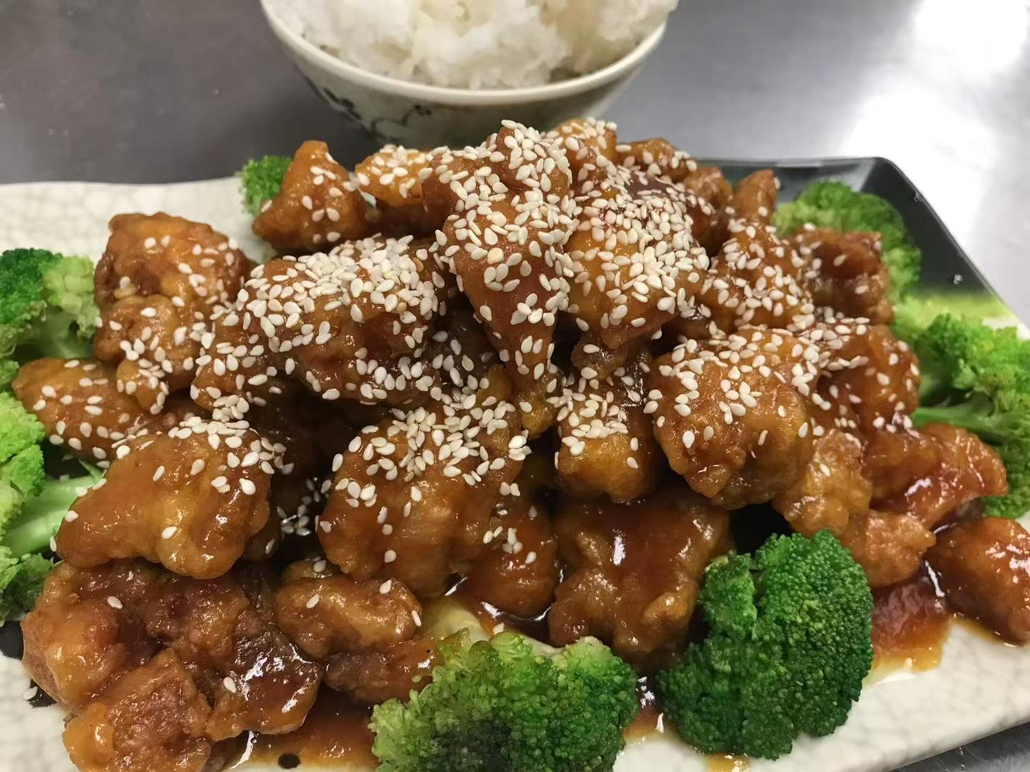 Sesame chicken with broccoli, glazed sauce, and steamed rice at East China, a Chinese restaurant in Waterloo