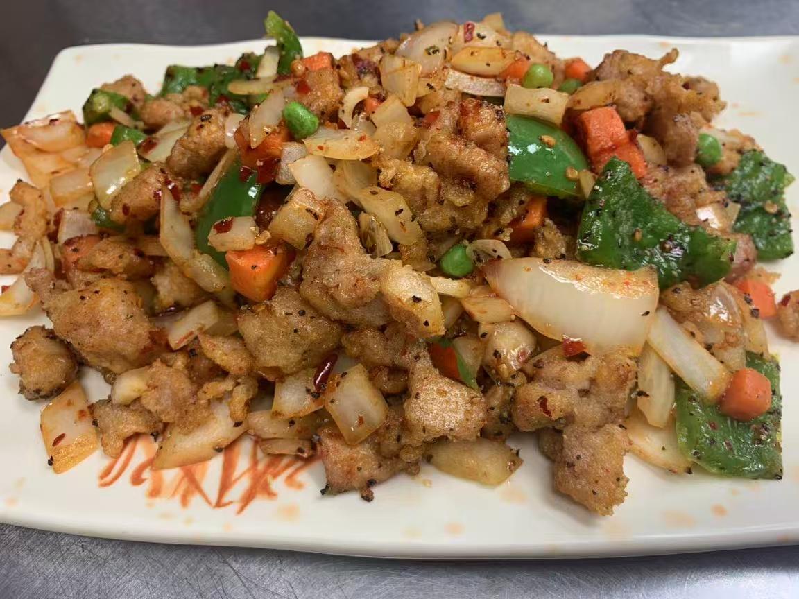 Spicy salt-and-pepper pork stir-fried with onions and bell peppers at East China, a Chinese restaurant in Waterloo