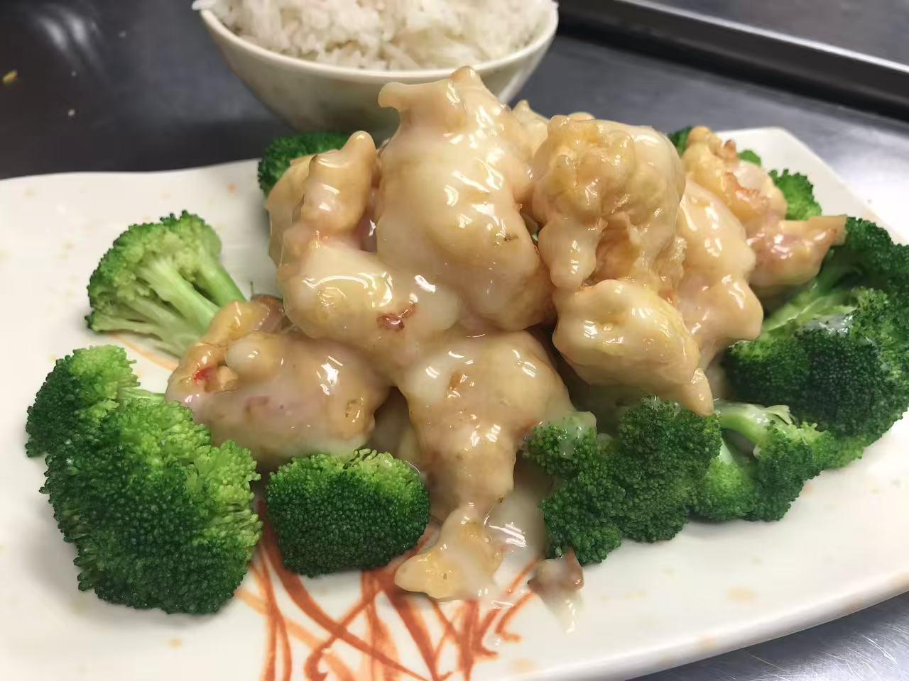 Creamy lemon chicken with broccoli and a bowl of white rice at East China, a Chinese restaurant in Waterloo