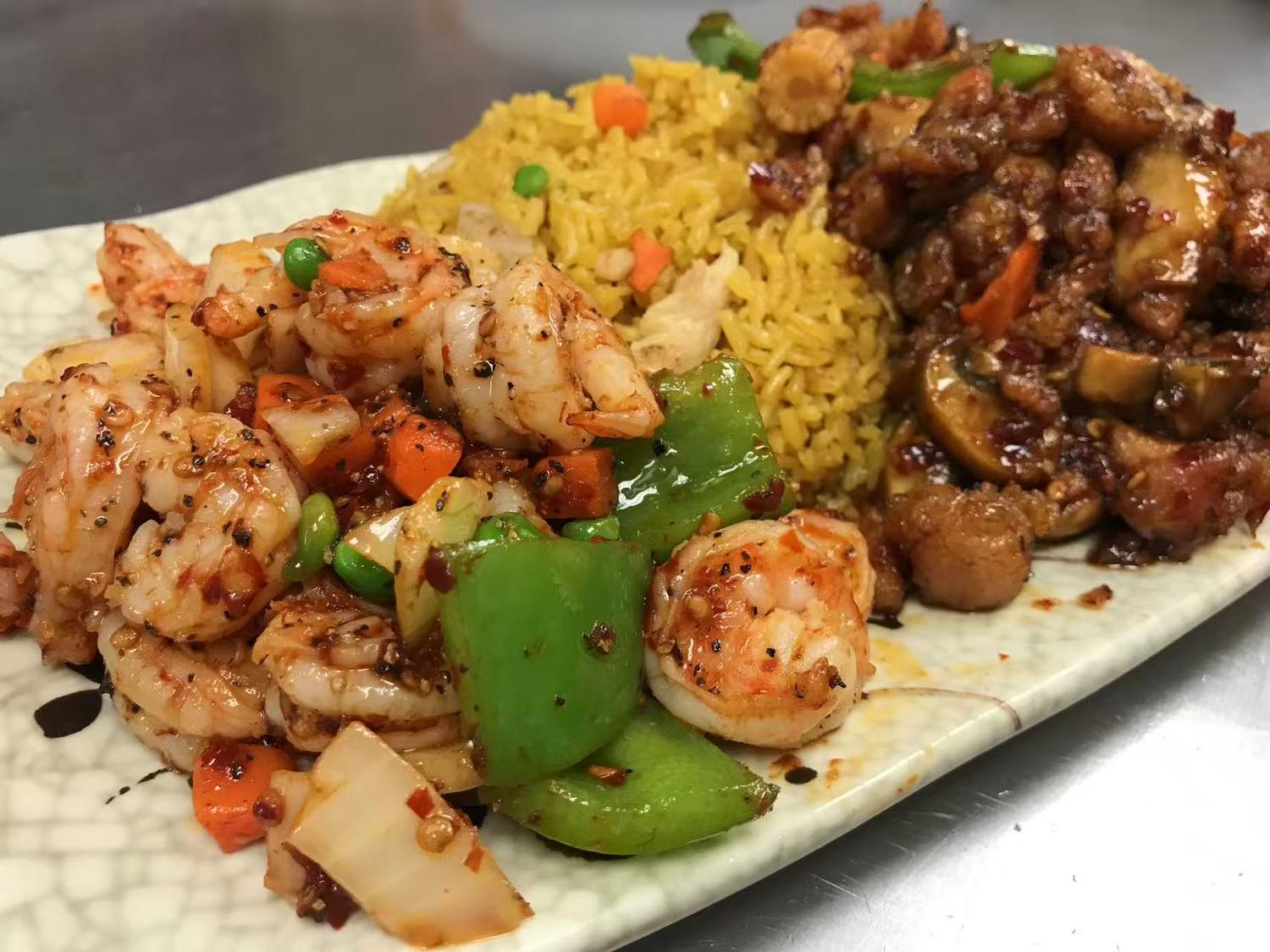 Combo plate with spicy shrimp, fried rice, and a savory meat dish at East China, a Chinese restaurant in Waterloo