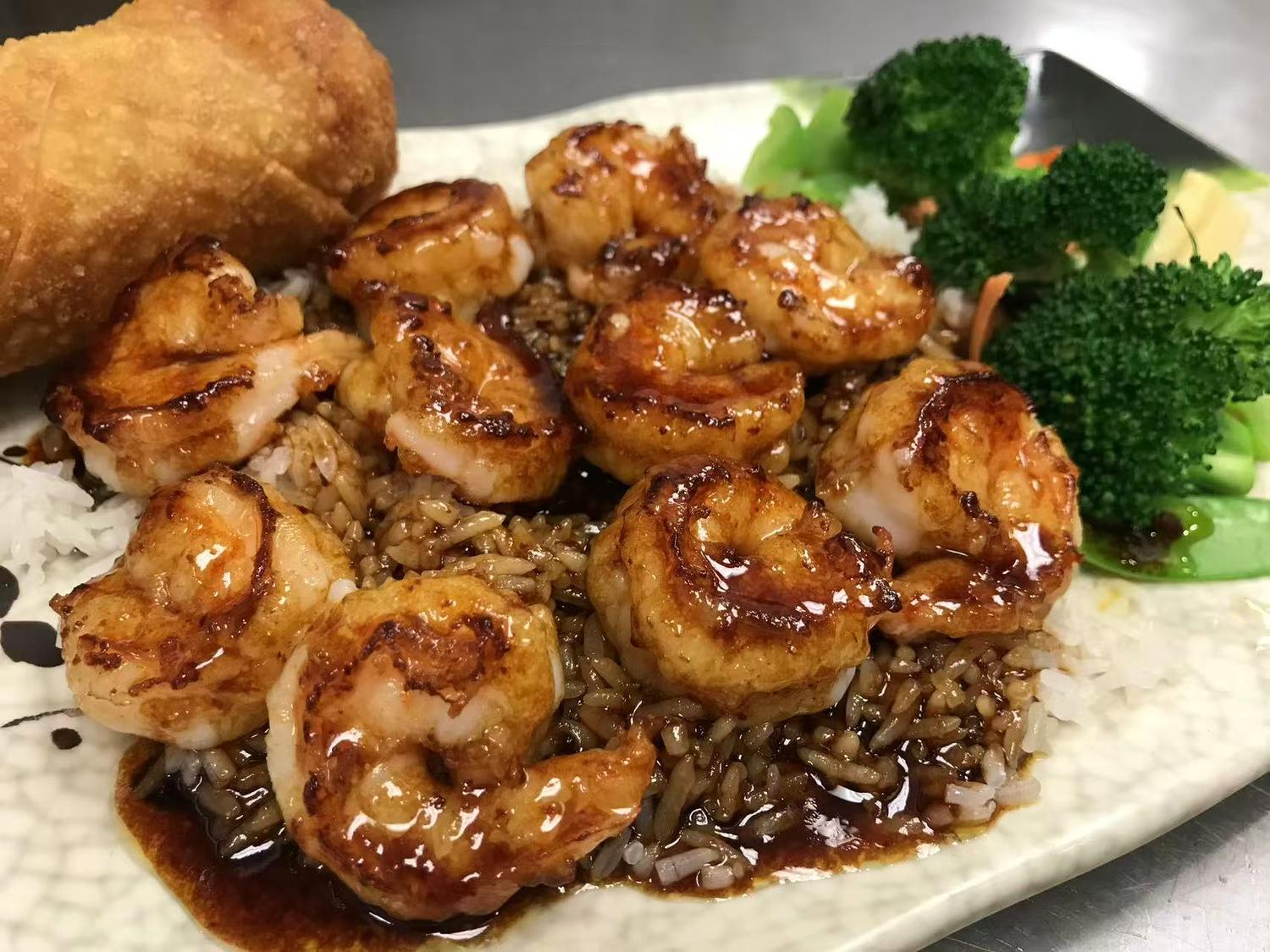 Grilled shrimp with teriyaki sauce, fried rice, broccoli, and an egg roll at East China, a Chinese restaurant in Waterloo