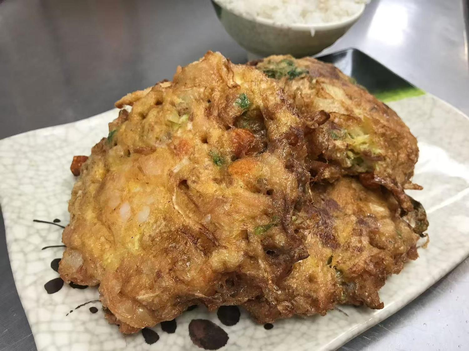 Crispy shrimp egg foo young patties served with steamed rice at East China, a Chinese restaurant in Waterloo