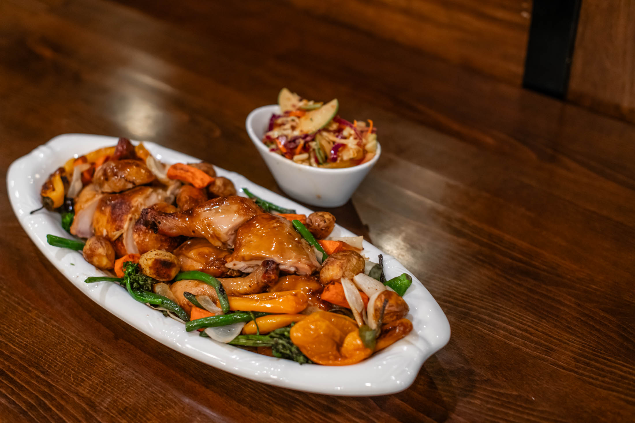 Glazed roasted chicken platter with mixed roasted veggies and side coleslaw at Canaan Chinese Cuisine, a Chinese Restaurant in CA