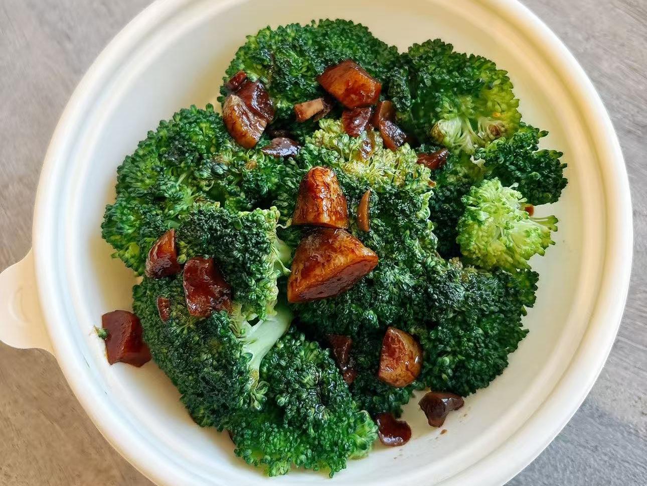 Fresh broccoli with savory brown sauce and nuts at EatGrand, a Japanese Restaurant in Los Angeles