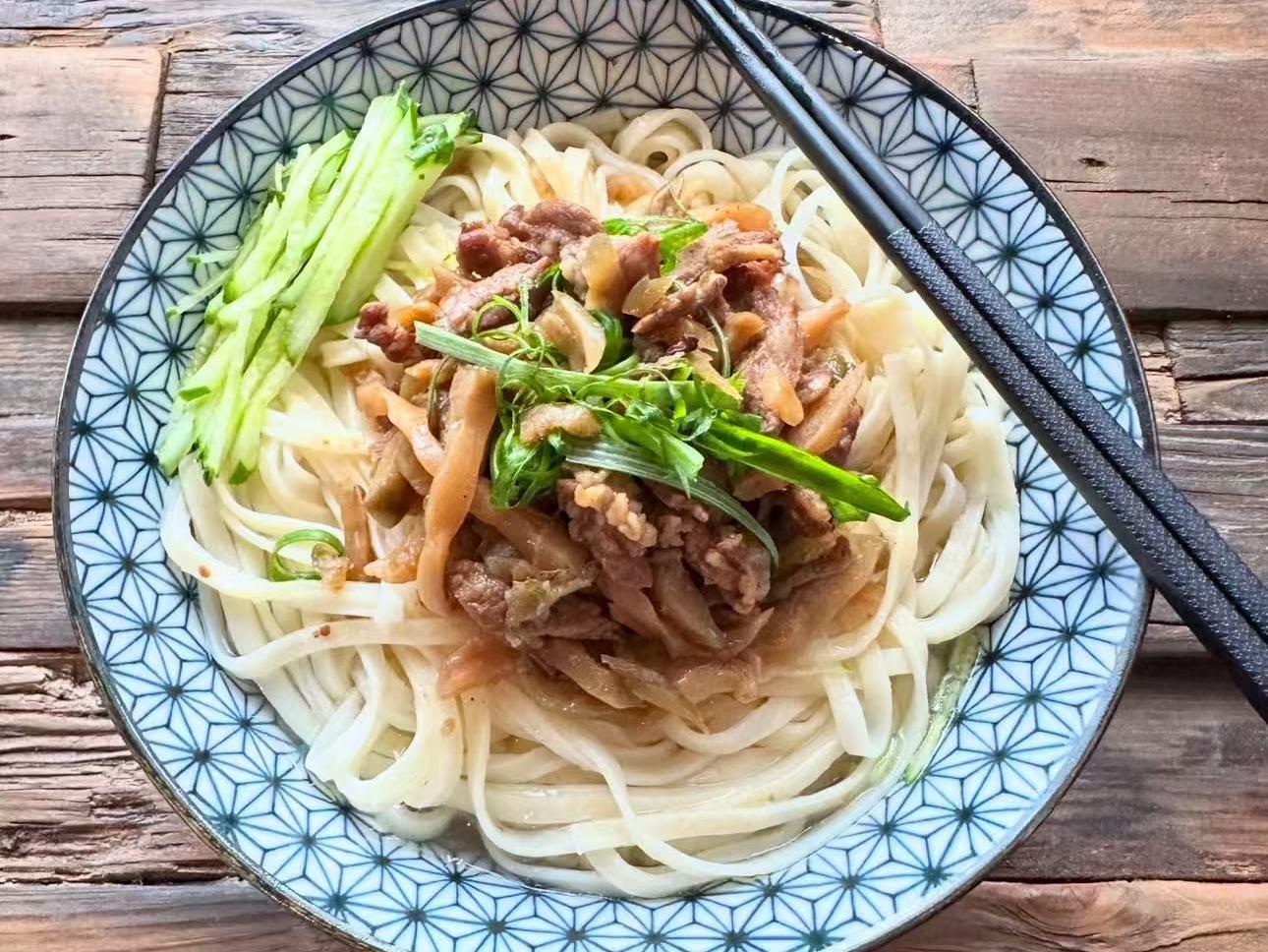 Noodles with tender pork, shredded cucumber and greens at EatGrand, a Japanese Restaurant in Los Angeles