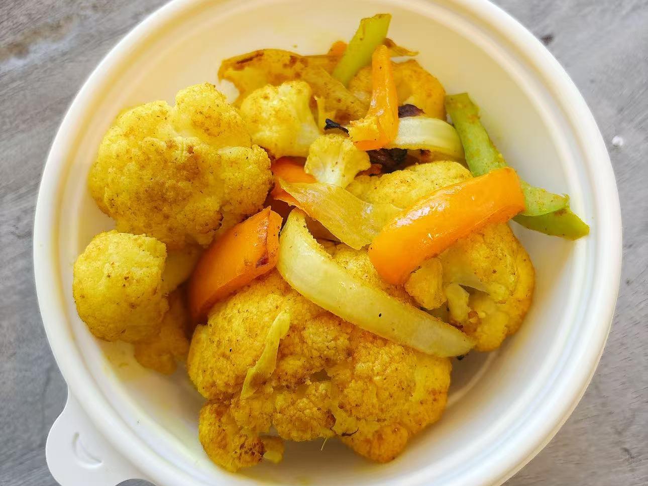 Cauliflower stir - fried with curry and mixed veggies at EatGrand, a Japanese Restaurant in Los Angeles