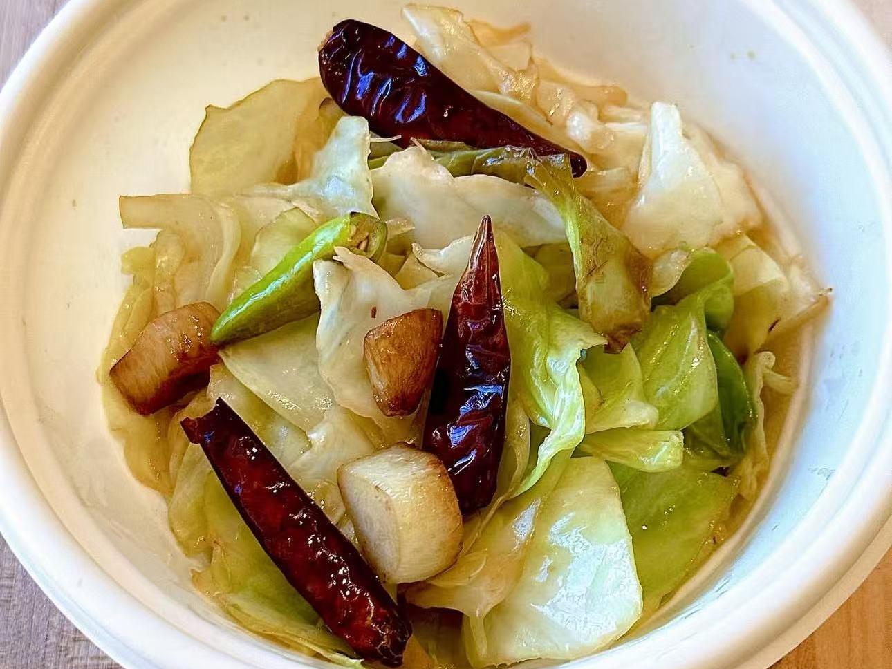 Stir - fried cabbage with chili peppers and garlic at EatGrand, a Japanese Restaurant in Los Angeles