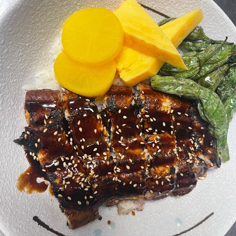 Unagi Don Grilled eel with rice, veggies and sesame at Shin Sushi, a Japanese restaurant in Pleasant Hill