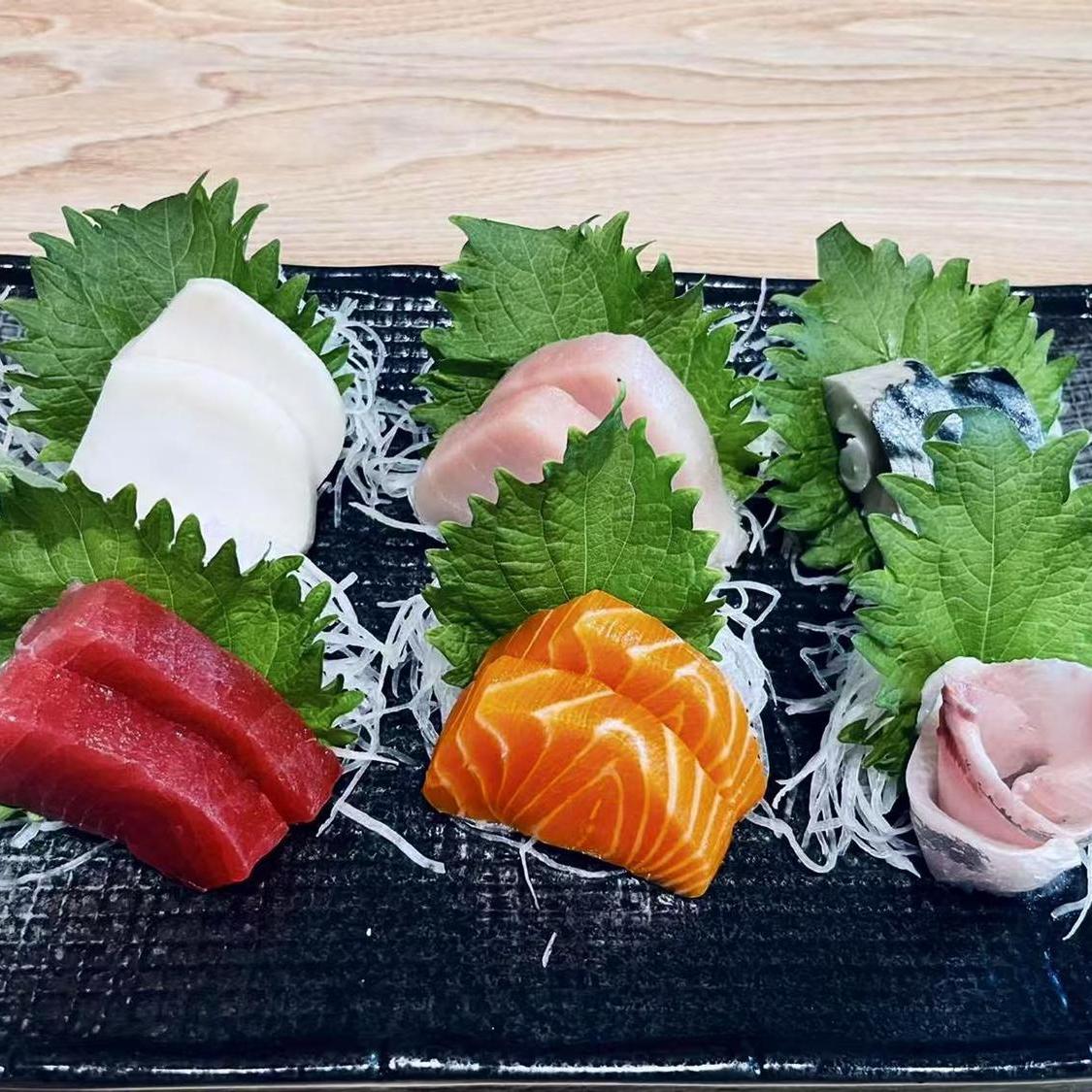 Assorted Sashimi Platter Fresh sashimi with shredded radish and shiso leaves at Shin Sushi, a Japanese restaurant in Pleasant Hill