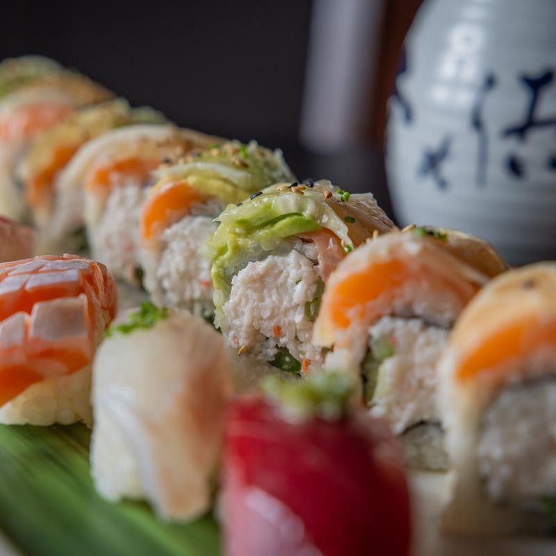 A set of close-up photos of sashimi and sushi.