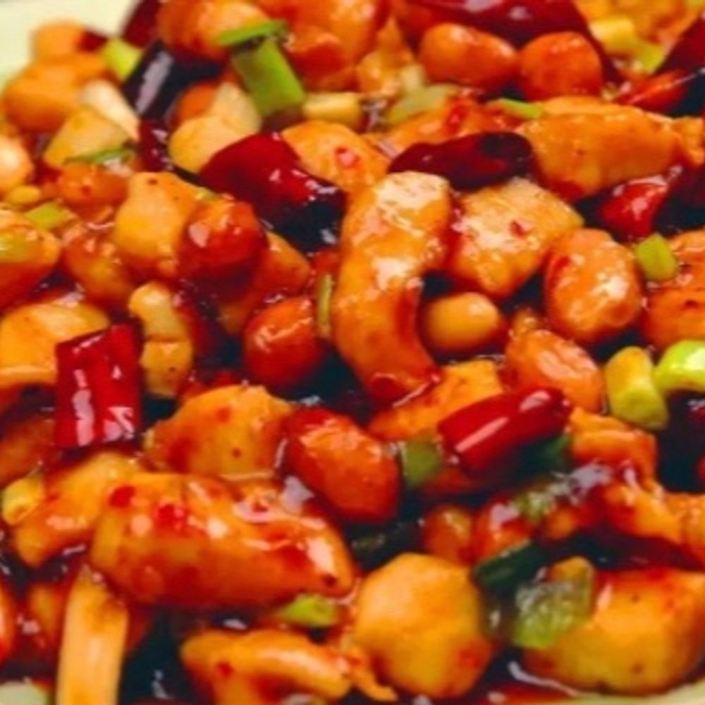 Kung Pao chicken with peanuts, dried chilies, and scallions
