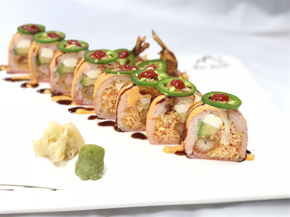 Spicy tempura shrimp maki rolls topped with jalapeno and chili sauce drizzle at Edo Japan, a Japanese Restaurant in Texas City
