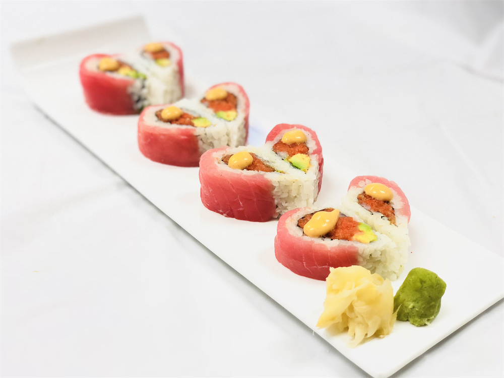 Tuna wrapped spicy tuna maki rolls served with pickled ginger and wasabi at Edo Japan, a Japanese Restaurant in Texas City