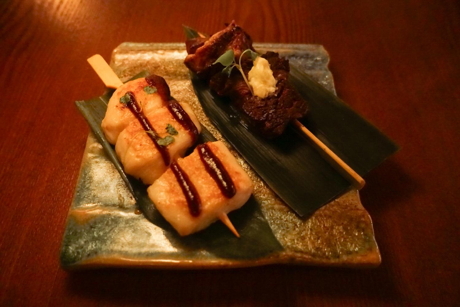 Grilled scallop & beef skewers on leaf plate at EGAWA, a Japanese Restaurant in Malvern