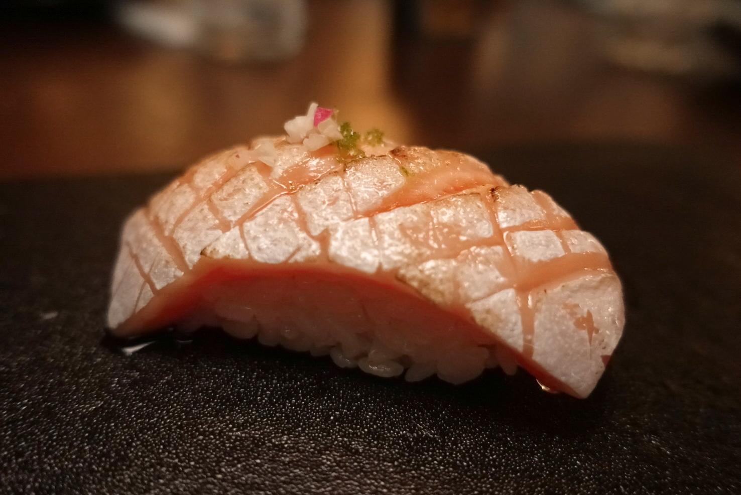 Seared sea bream nigiri sushi with minced garnish at EGAWA, a Japanese Restaurant in Malvern