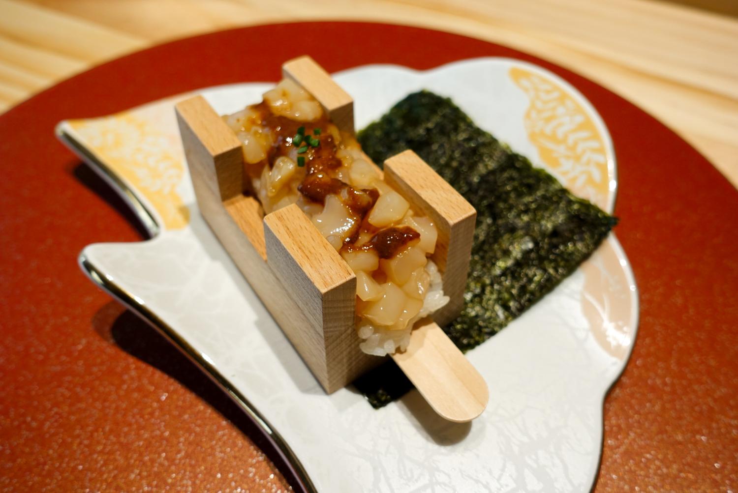 Squid rice roll in wooden mold with seaweed sheet at EGAWA, a Japanese Restaurant in Malvern
