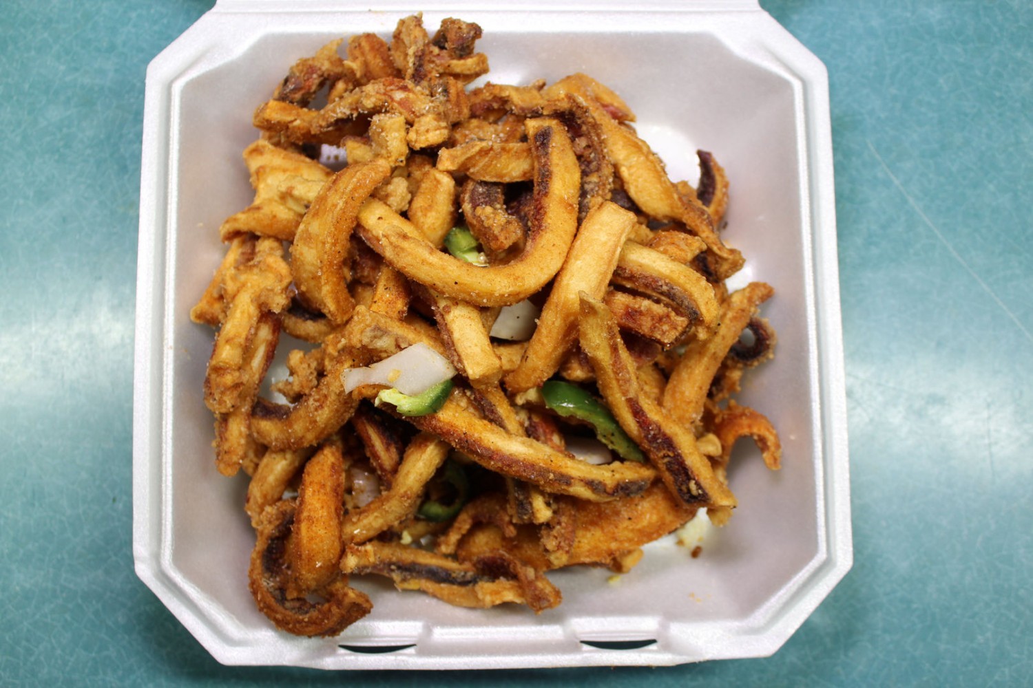 Crispy seasoned fried squid strips with pepper veggies at Elgin Buffet, a Buffet Restaurant in Elgin