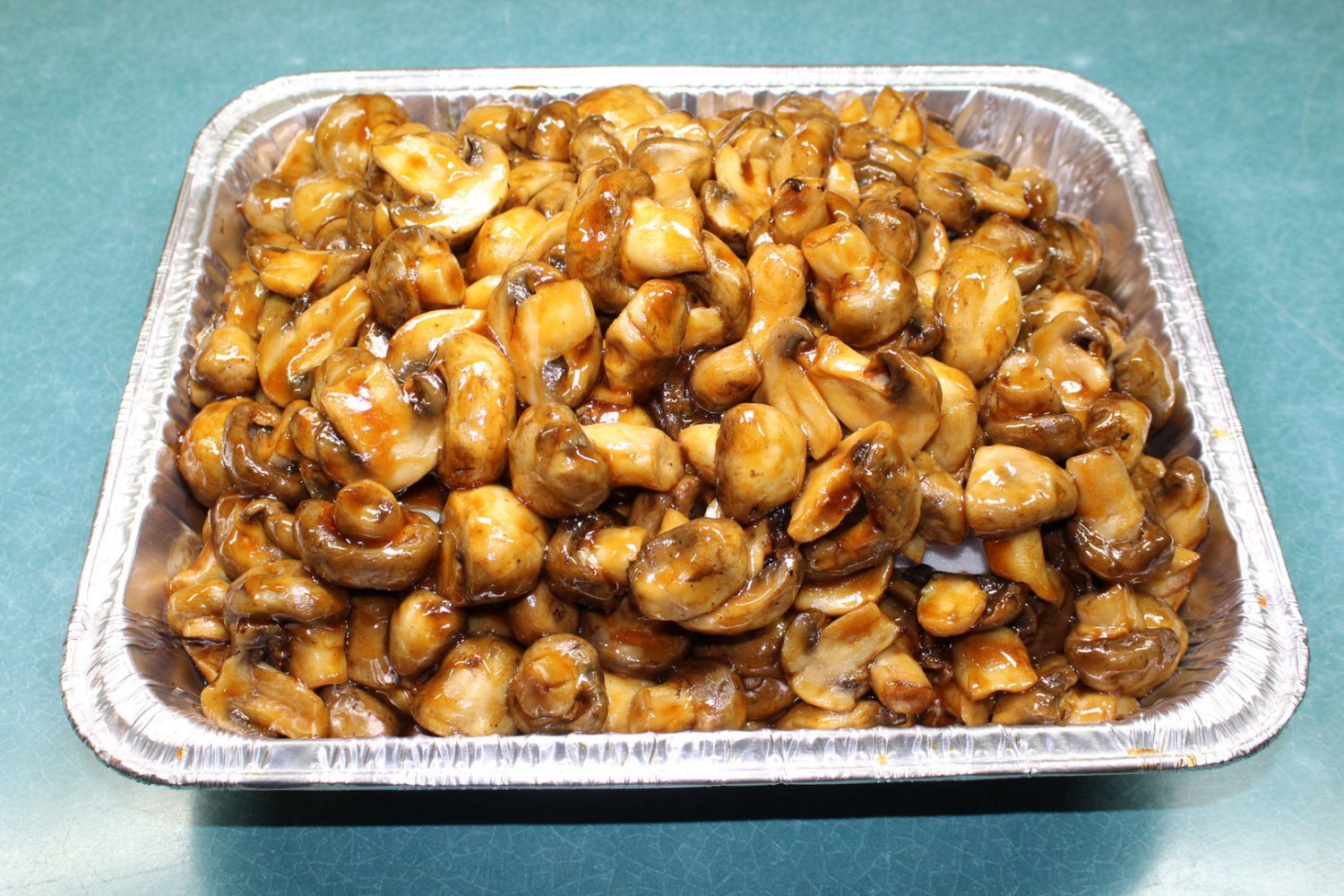 Glazed braised button mushrooms in savory brown sauce at Elgin Buffet, a Buffet Restaurant in Elgin