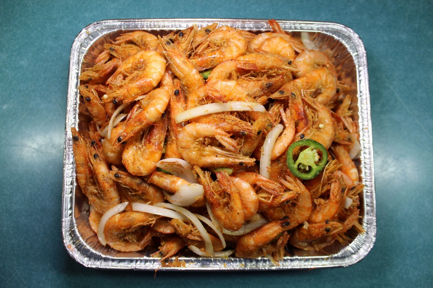 Seasoned whole fried shrimp with onion and jalapeño at Elgin Buffet, a Buffet Restaurant in Elgin