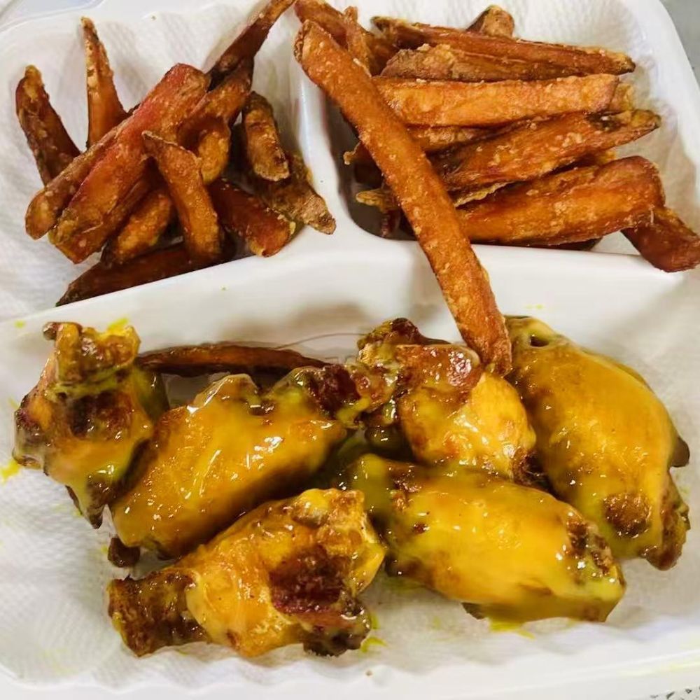Empire-Wings-Chicken-Wings-Restaurant-Cheese-Chicken-Wings-and-Sweet-Potato-Fries-Brooklyn Cheese chicken wings with sweet potato fries at Empire Wings, a Chicken Wings Restaurant in Brooklyn