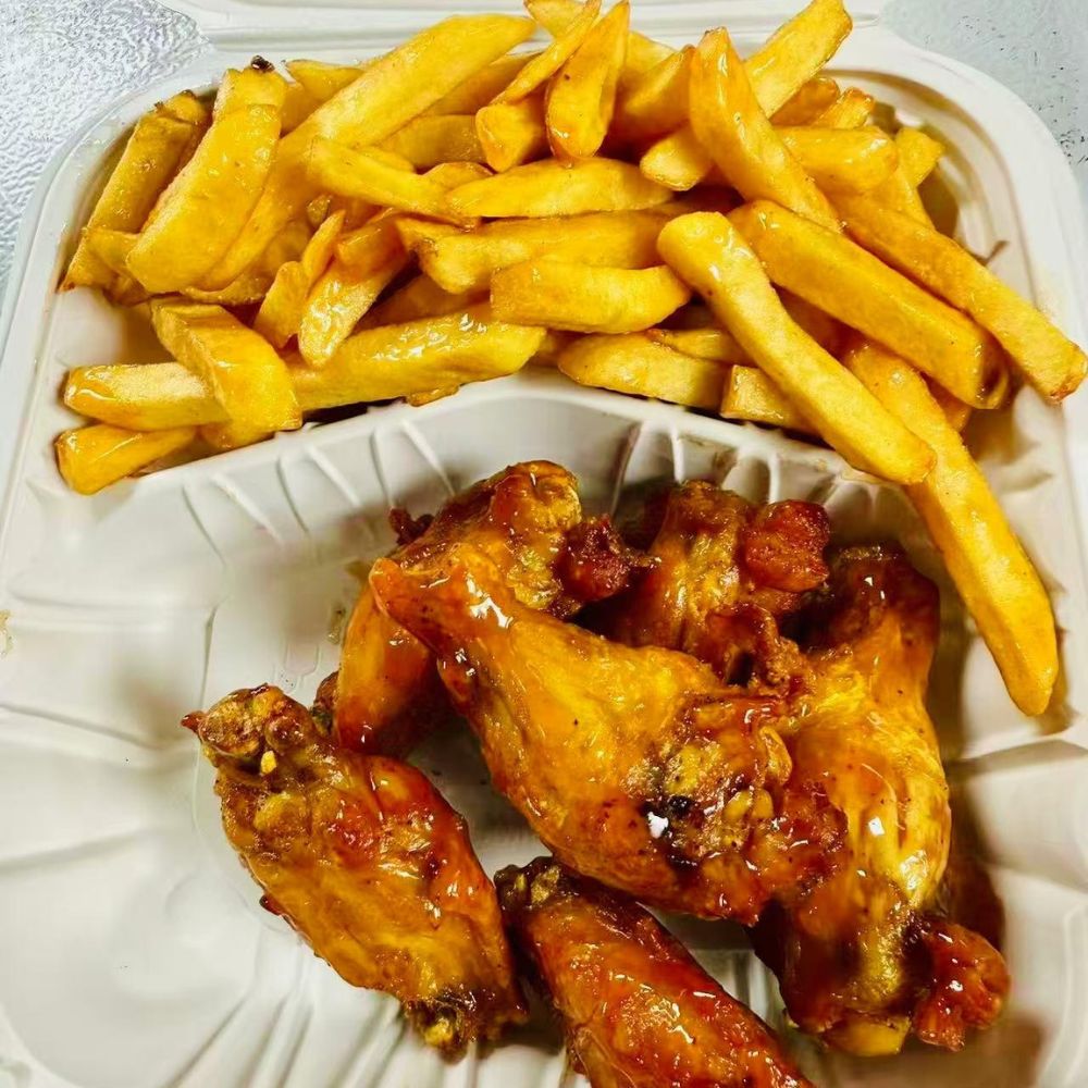 Empire-Wings-Chicken-Wings-Restaurant-Glazed-Chicken-Wings-and-Fries-Brooklyn Glazed chicken wings with fries at Empire Wings, a Chicken Wings Restaurant in Brooklyn